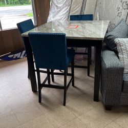 Brand new 36 inch high table and 24 inch barstools set for only $600 brand new