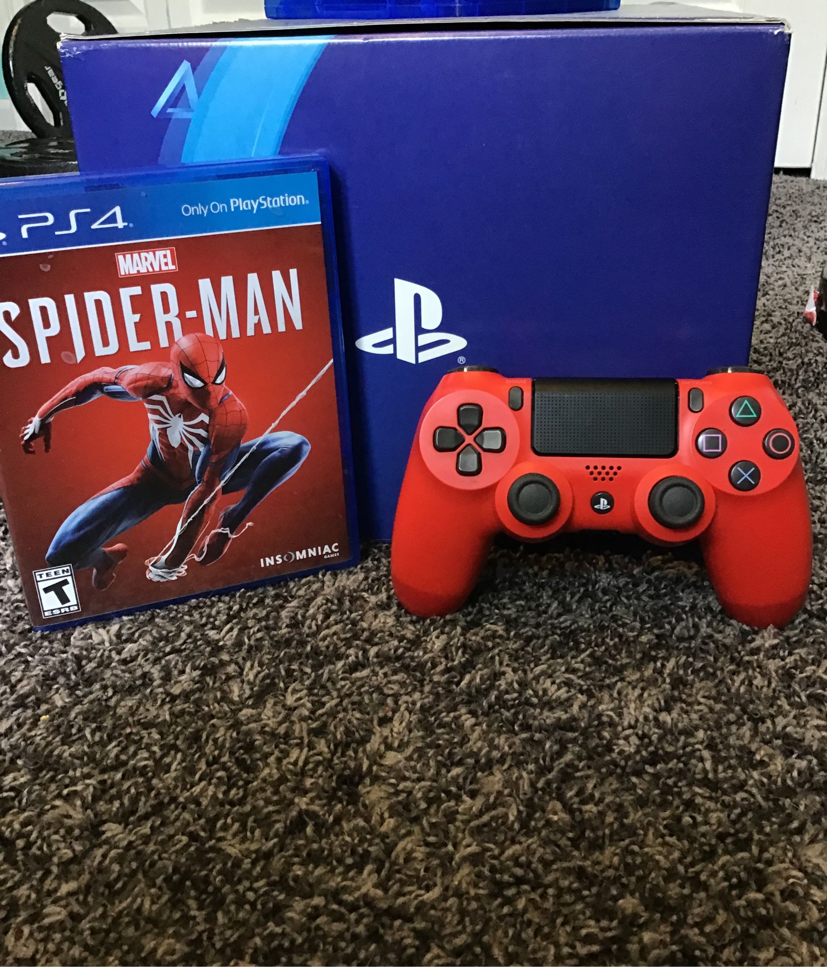Spider-Man game and Red PS4 controller.