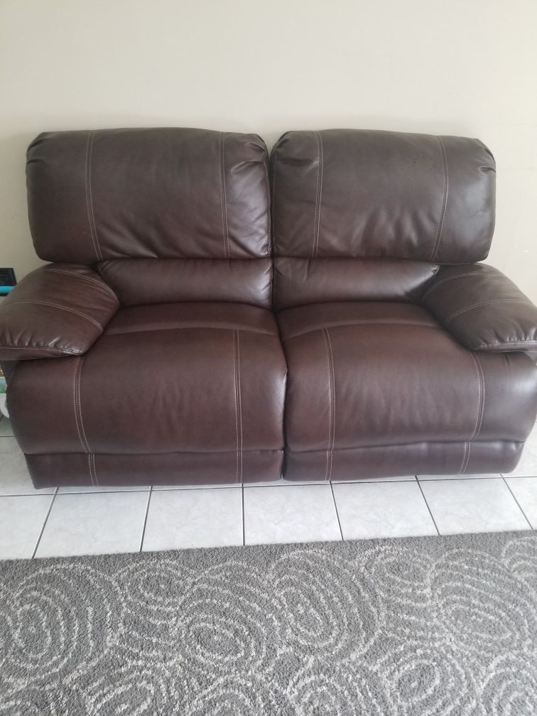 Brown leather loveseat recliner from Bob's Furniture FLEXIBLE on $