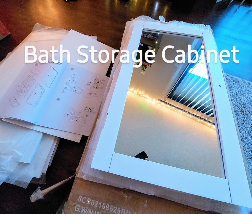 White bath storage cabinet with mirror open box