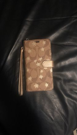 Coach phone case with pockets for cards and hand strap. Original