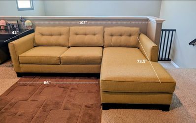 Green couch with right chaise