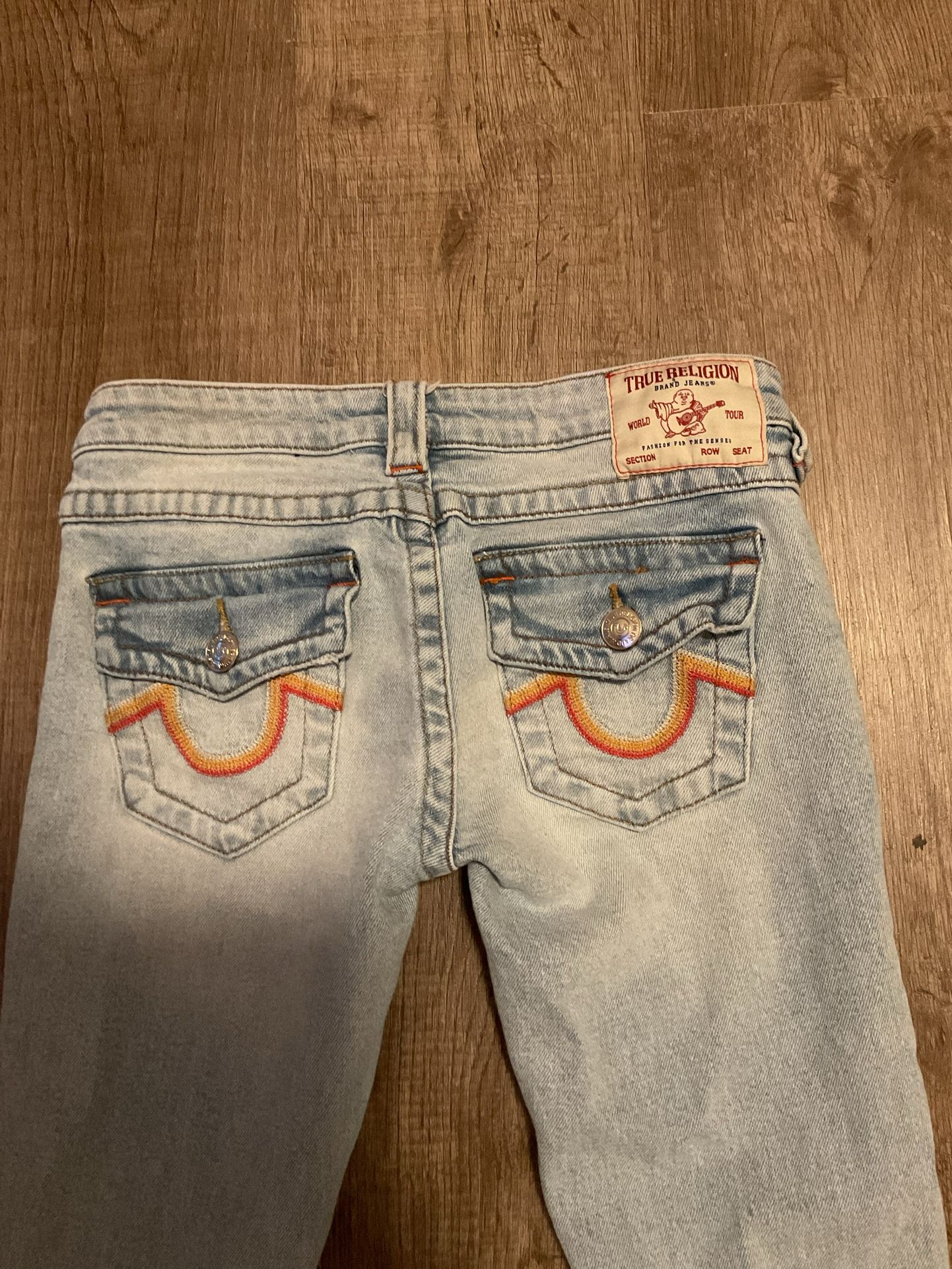 women’s True religion light wash low rise red and orange flare jeans