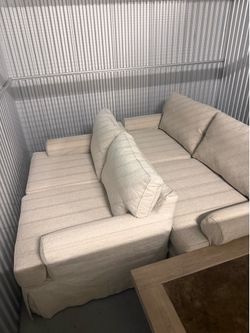 Matching sofa and love seat set, excellent condition. Cover can be removed and washed