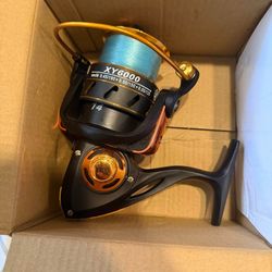 Xy6000 fishing reel with line like new