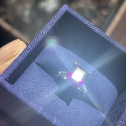 Platinum Band With Emerald Cut Purple Sapphire and Two Qtr Carat Diamond Baguettes
