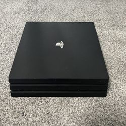 PS4 Pro With 1TB Hard Drive With Games And Controllers