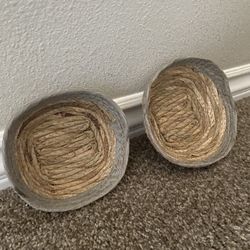 2 Woven baskets made from natural fibers like seagrass, water hyacinth, or bamboo