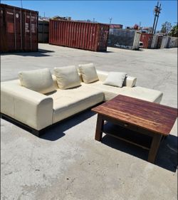 Cream Leather Sectional Sofa and Rustic Wood Coffee Table