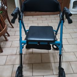 Transport Chair/Walker, it Holds Up To 350lbs. It Has A Bag Underneath That Can Hold Your Purse, Wallet Or Groceries Or Whatever You Want.