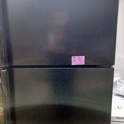 Refrigerator Top Freezer Like New 6 Months Warranty Black In Color.