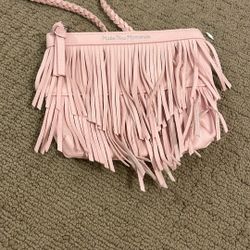 Pink Purse With Little Mini Like Strings Hanging On The Outside