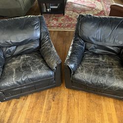 Pair of black leather sofa chairs