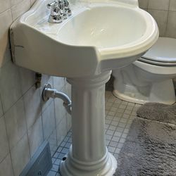 Pedestal sink with Moen faucet