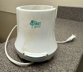 The First Years Simple Serve fast baby bottle warmer and sanitizer.