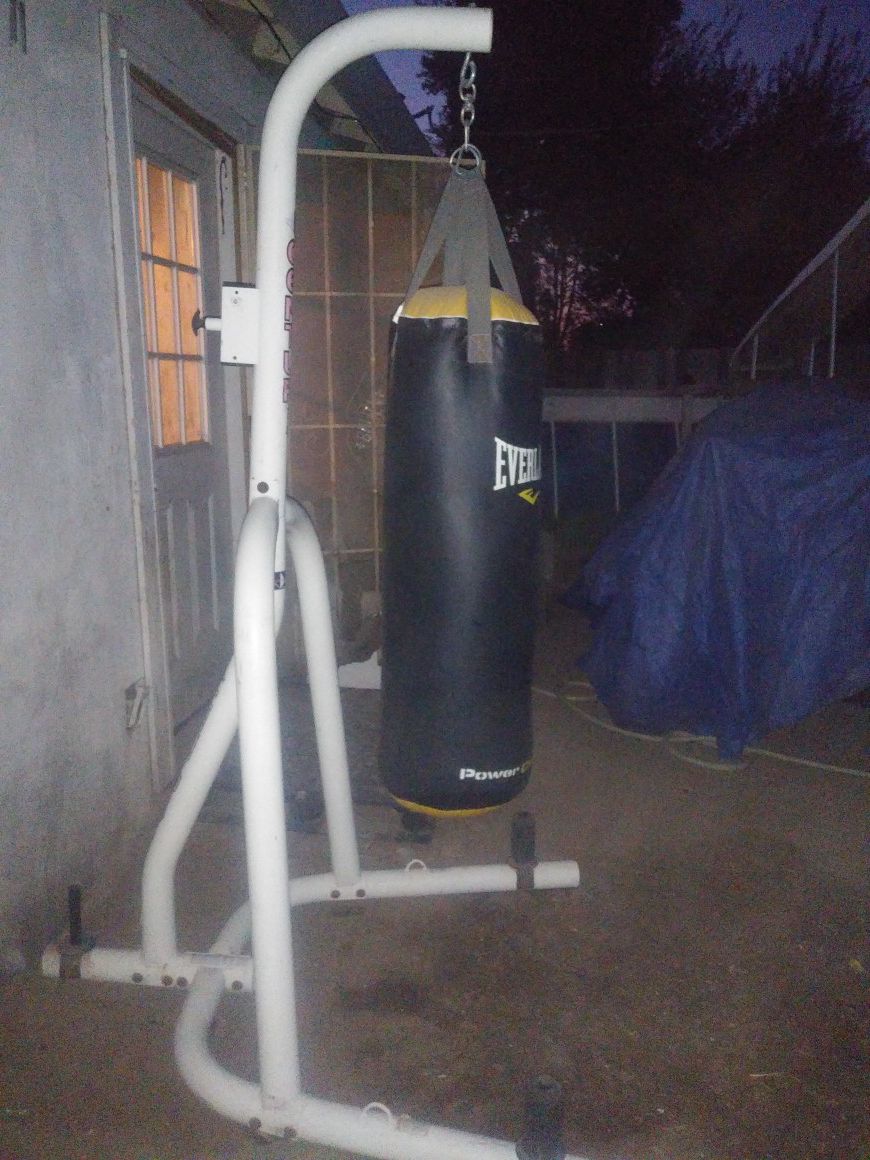 Punching bag and stand. 100 pound heavy bag great shape