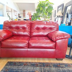 Signature Series Brick Red Leather Couch from Ashleys.