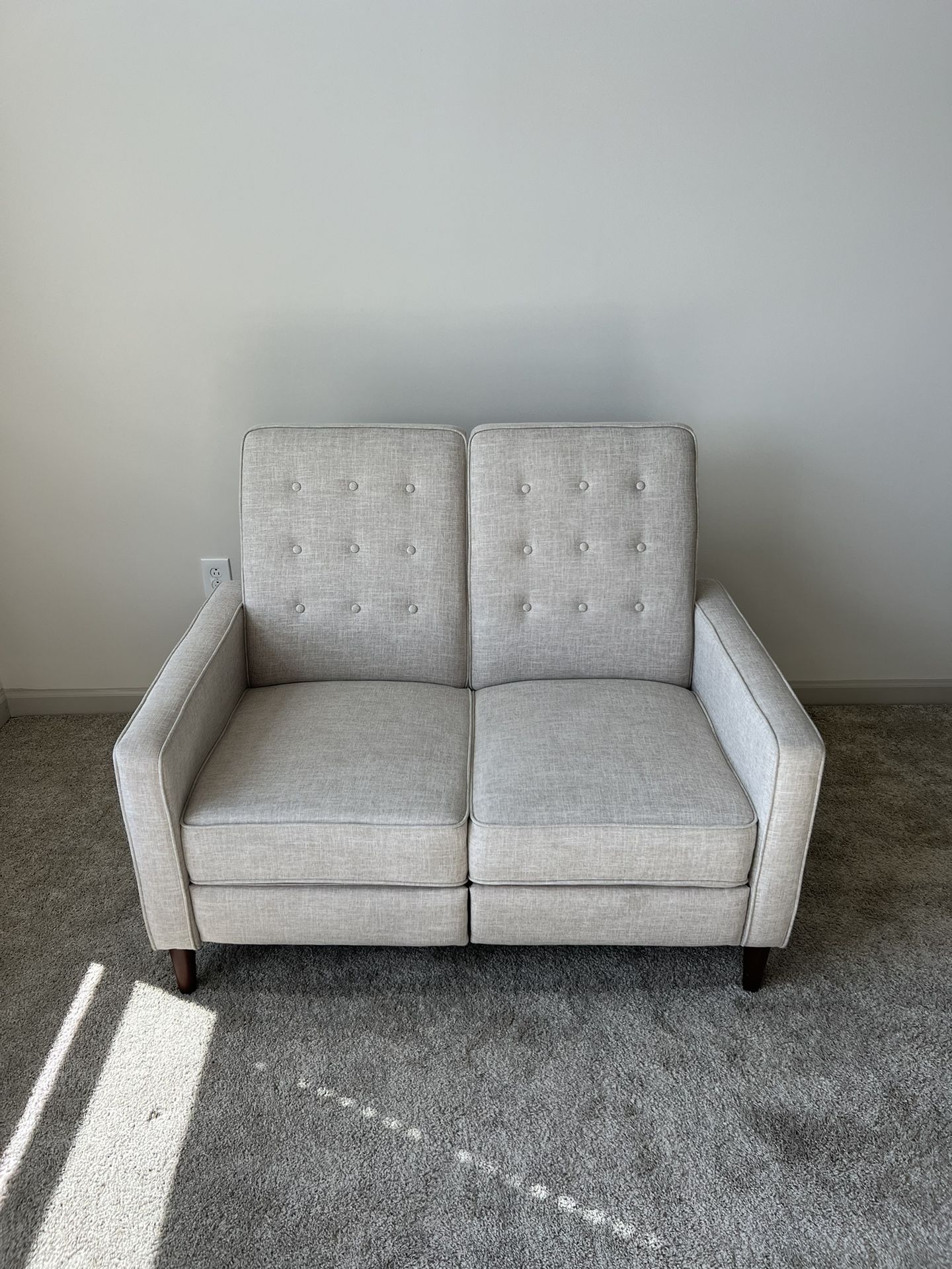 Small beige reclining couch