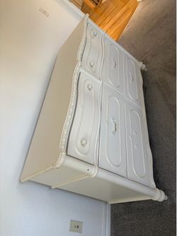 White chest of drawers.