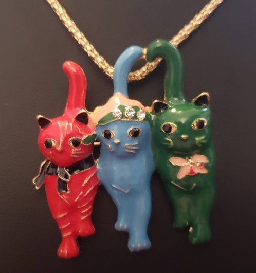 NEW Cat Trio Necklace.  Back of the Pendant is a pin so can also be worn as a Brooch.  Pendant is approximately 2" long x 1.5" wide. Pendant has Red, 