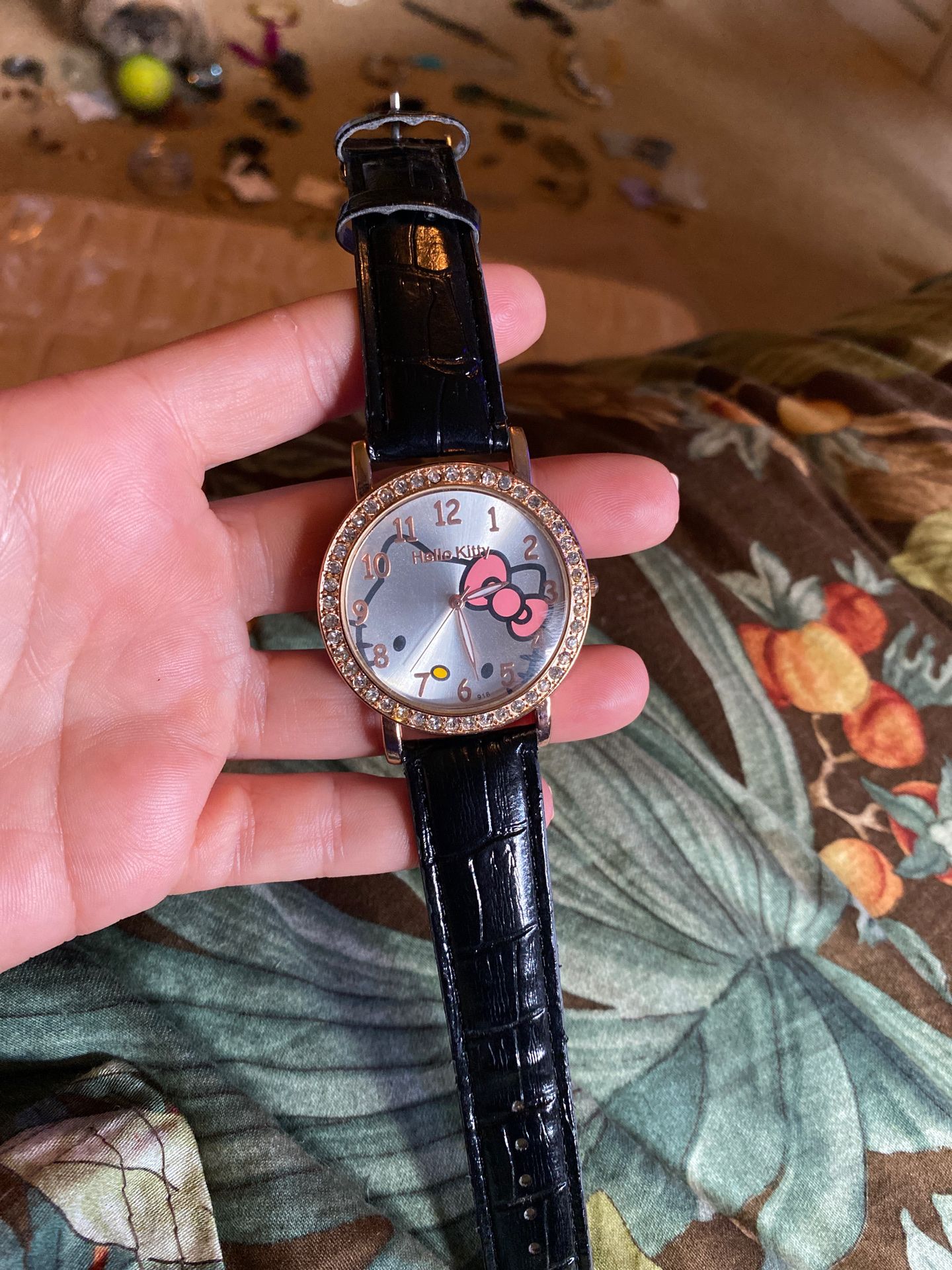 Hello kitty watch. Rose gold. Black leather band.