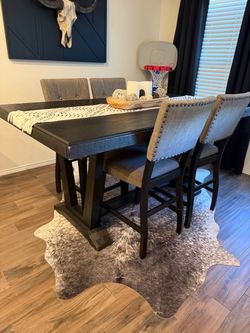 Bar height table and 4 chairs