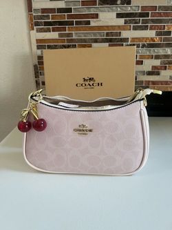 Pink woman purse with charm