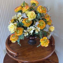 Pot With Fake Yellow Flowers. 