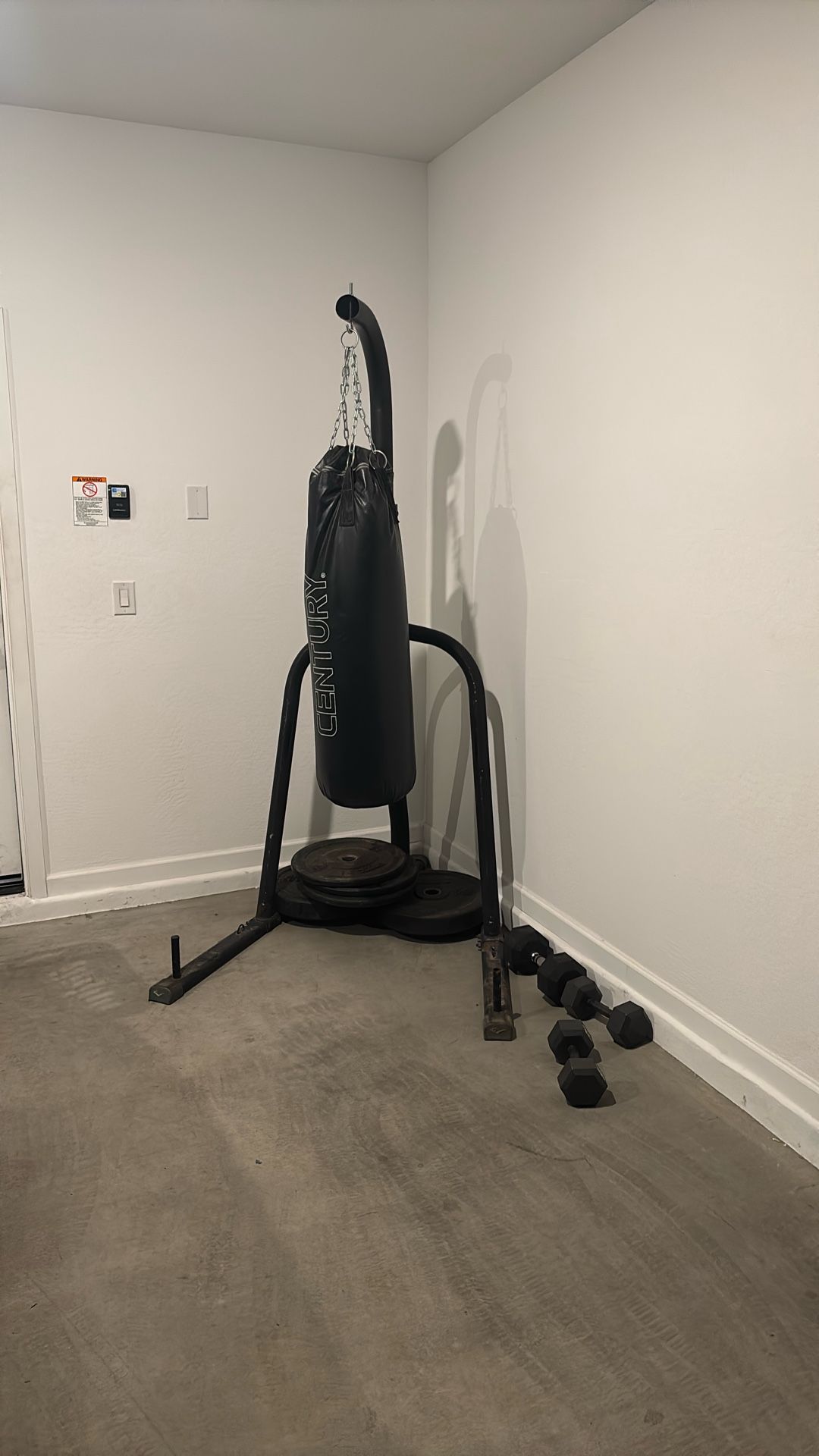 Punching Bag And Stand With Miscellaneous Weights.