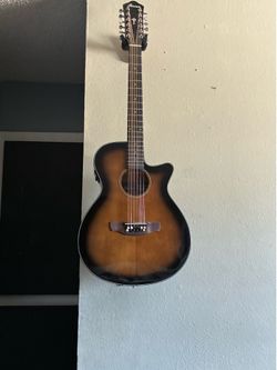 Acoustic 12 string guitar with a built in tuner.
