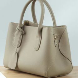 🔥2025 new] Leather Milk White Large Capacity Women's Bag Handheld Crossbody Commuting Mom Bag New Idle
 