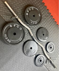 48 inches Steel Standard Barbell W/Weight Plates: 25s, 10s and 5s ponders. 93 # Brute W.
