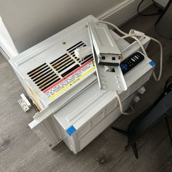 Ac Window Unit And A Fan 