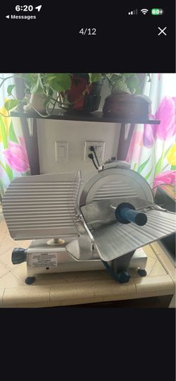 This is an Edlund EDV-12C Edvantage 12-inch gravity feed meat slicer.