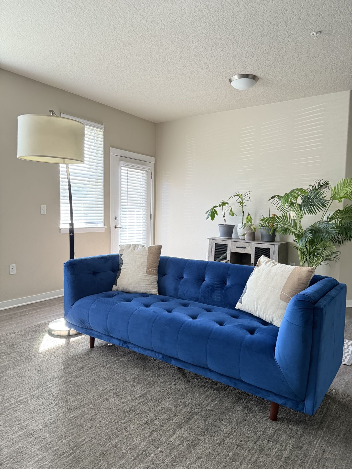 Blue tufted velvet couch