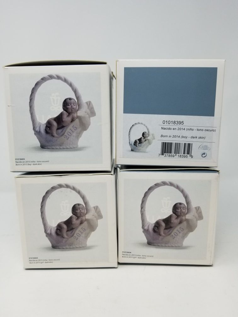 Lladro collectible born in figurines, 3 sealed, one opened