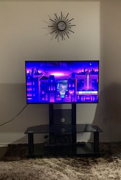 Roku tv + Glass Black Stand