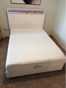 Queen sized bed and bed frame. LED