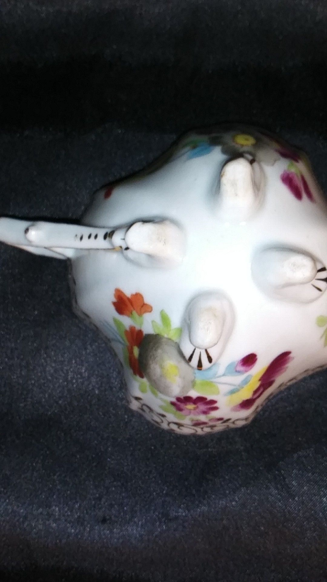 Miniature Porcelain Tea Cup. Four Footed Hand Painted Gold Trim