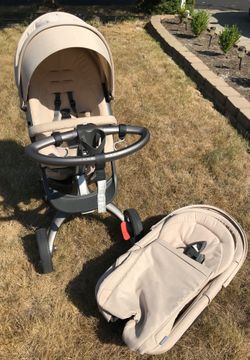 Stoke Xplory Beige stroller w/ bassinet and Attachments