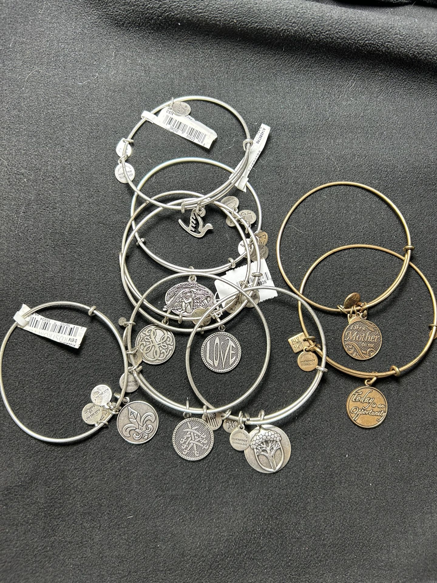 9 Alex And Ani Bracelets. 
