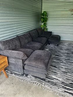 Black couch and rug