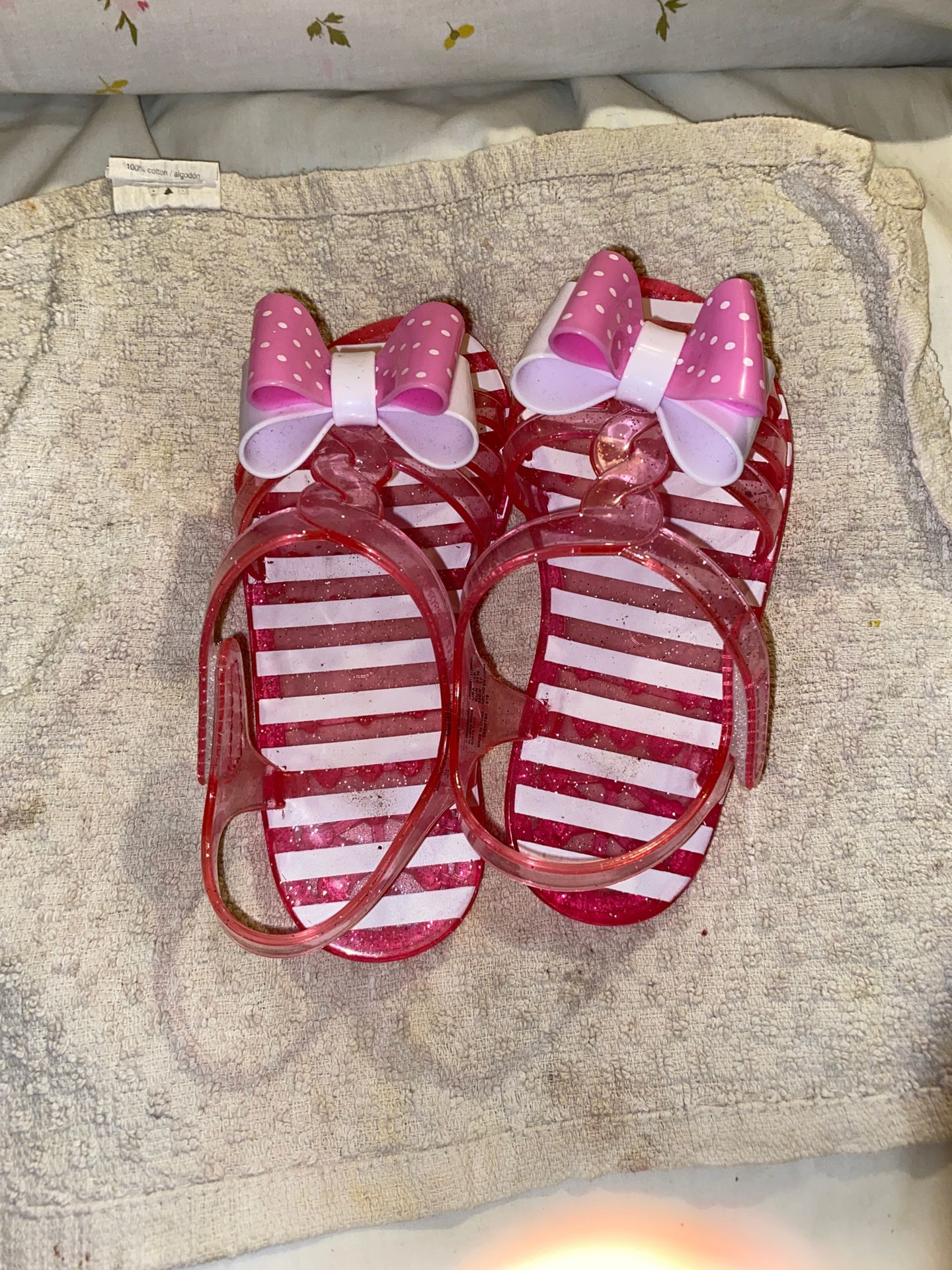 Pink and white sandals with bows