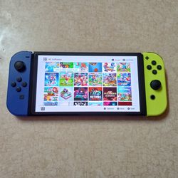NINTENDO SWITCH OLED with Over 100 POPULAR SWITCH GAMES and 512GB MEMORY 