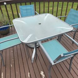 Glass Table And Four Chairs
