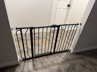 Baby Gate adjustable 26-49 inches wide. 30 inches tall