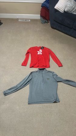 Two men’s small golf tops