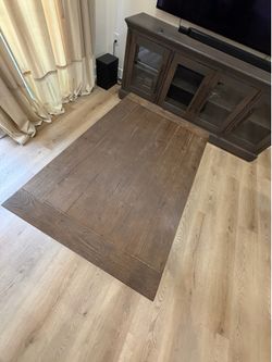 Rustic farmhouse-style coffee table with caster wheels ( 2 available each $200)