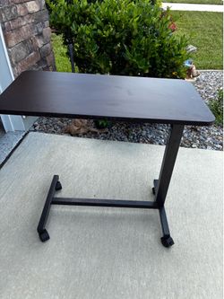 REDUCED Adjustable height rolling table
