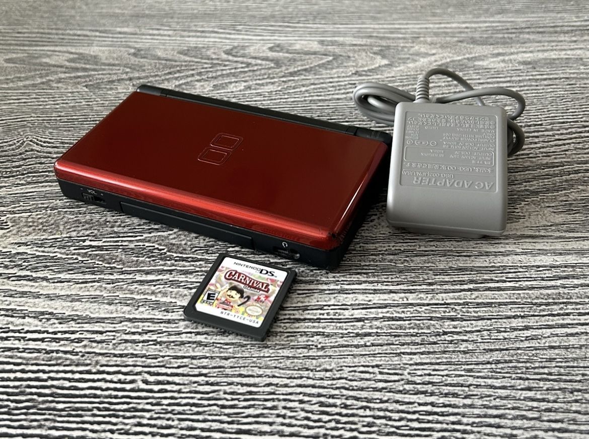 Nintendo DS in nice condition with a game, complete with stylus & charger. $40